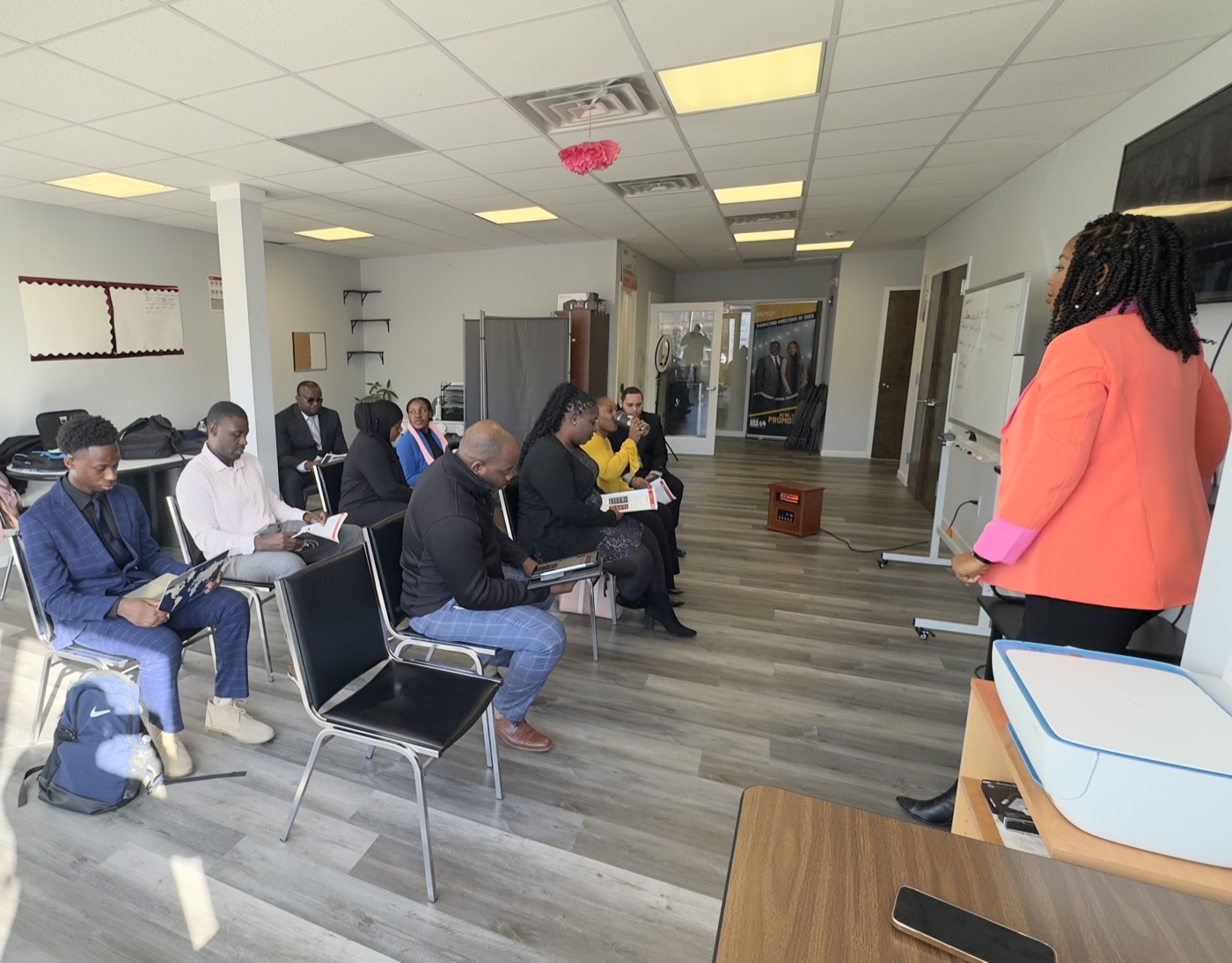 Cherry Jane presenting in front of the agent team during a meeting